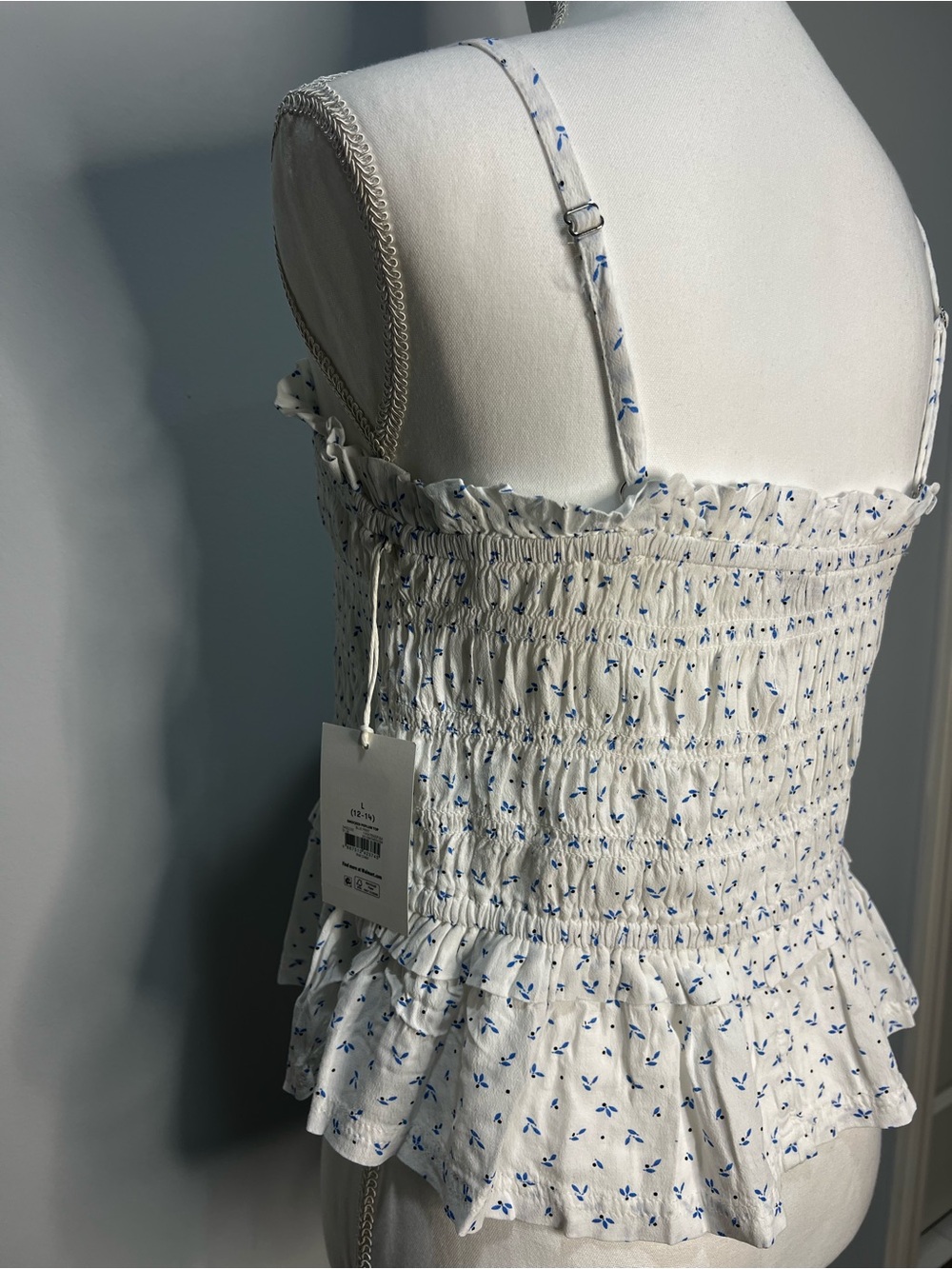 White Smocked Ruffle Cami with Blue Floral Print . I have them in sizes L and M.